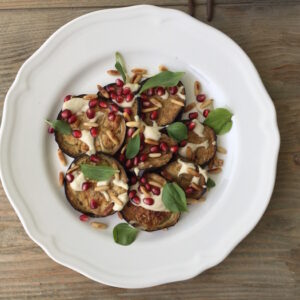 Roasted eggplant recipe with Tahini and sweet pomegranates. This is such a flavorful but easy recipe.