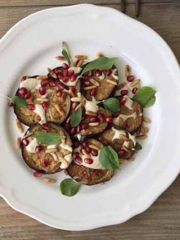 Roasted eggplant recipe with Tahini and sweet pomegranates. This is such a flavorful but easy recipe.