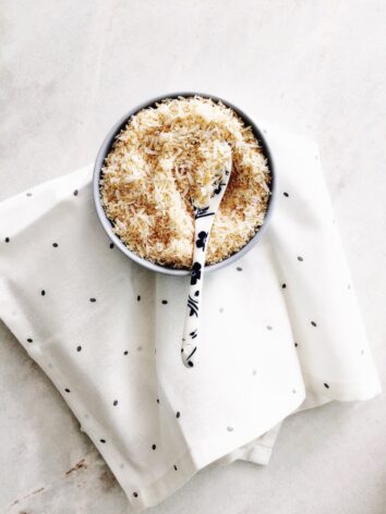 Toasted coconut flakes in a bowl.