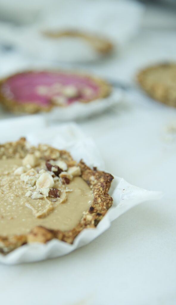 Delicious baked granola tarts with peanut butter filling (and pitaya fruit)