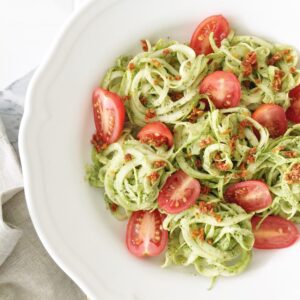 Pesto zucchini noodles with fresh and dried tomatoes