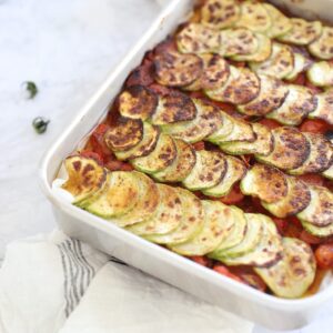 Vegan baked polenta with tomato compote and roasted zucchini